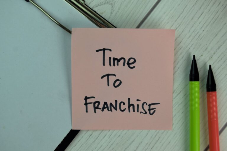 Pink sticky note with “Time to Franchise” written on it