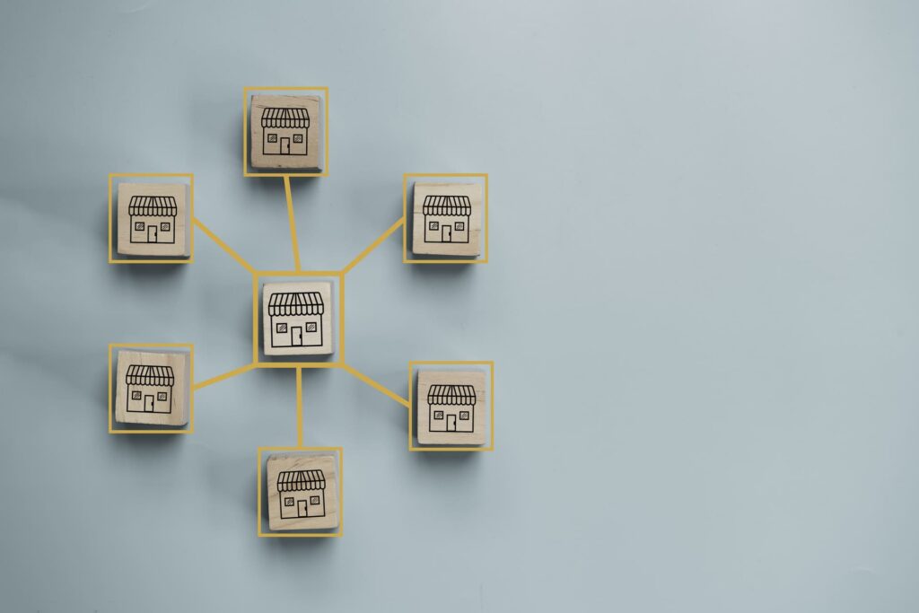 Wooden blocks connected with lines showing a franchise network concept