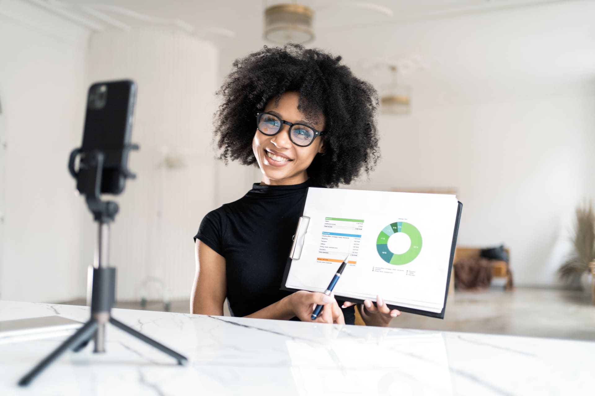 cheerful-woman-presenting-statistics-of-profitable-business