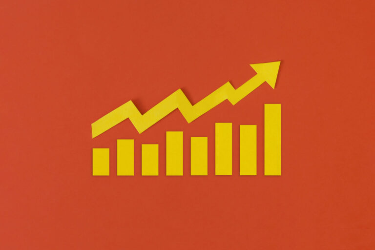Yellow graph with arrow on red background