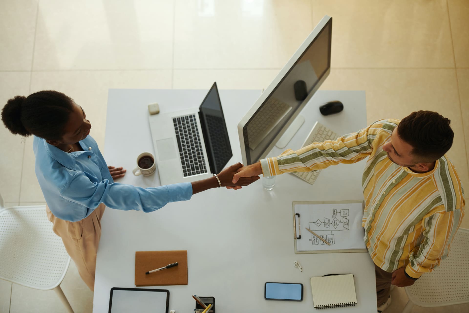 business-handshake-between-two-colleagues-at-office