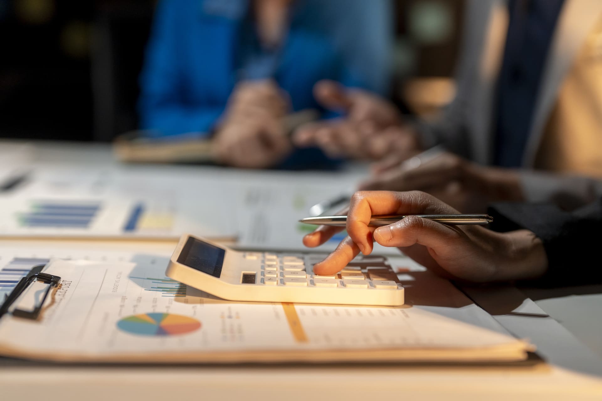 business-team-analyzes-charts-and-graphs-at-workplace