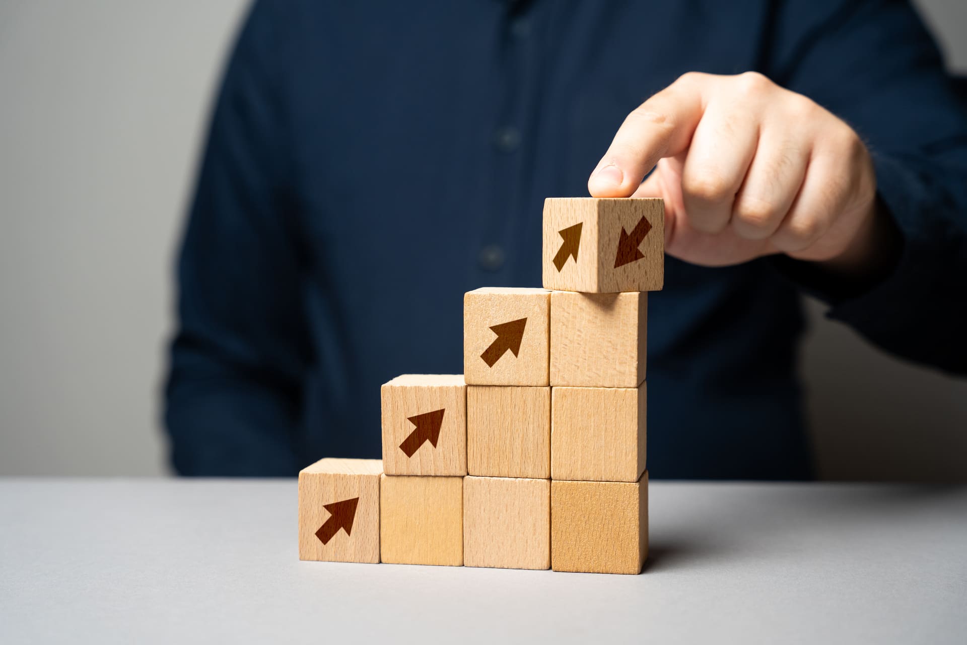 growth-strategy-concept-with-wooden-blocks-and-arrow