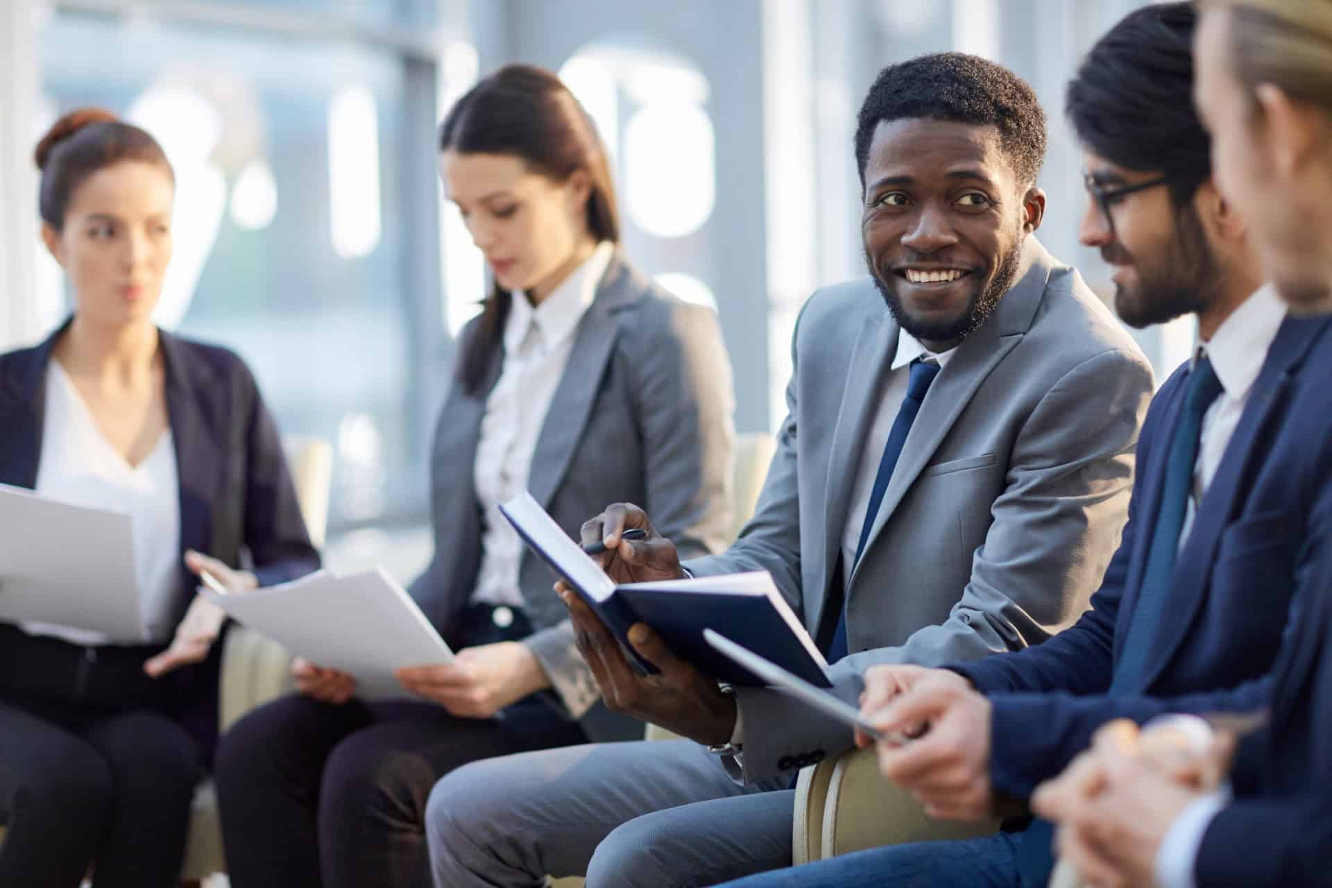 Business colleagues discussing documents during a corporate meeting
